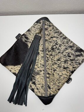 Spotted Black and Cream Cowhide Tassel Cosmetic Clutch